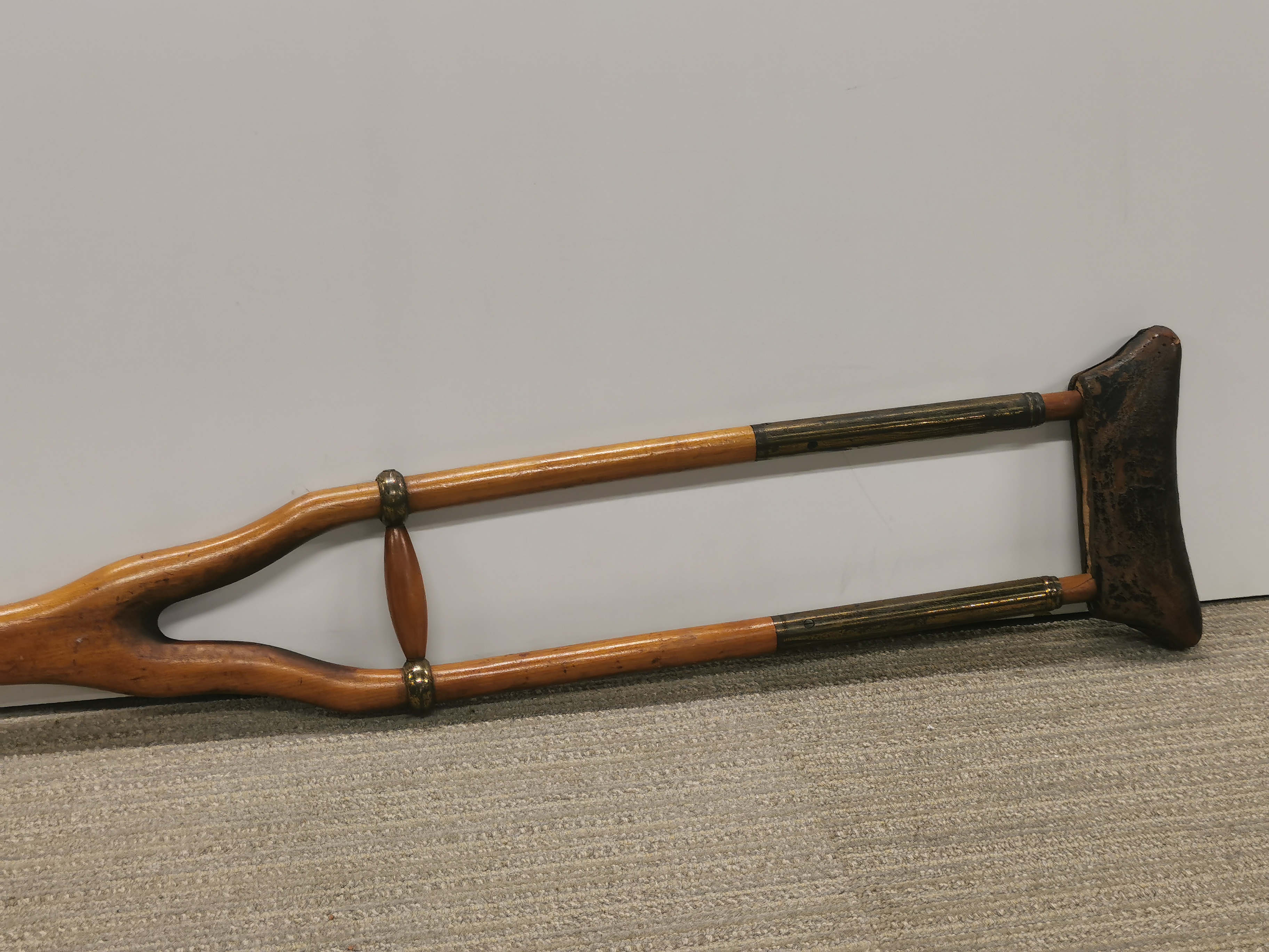 An early brass wood and leather crutch. - Image 2 of 4