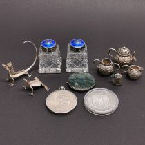 A group of mixed silver and other items.