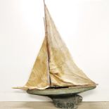 An early wooden pond yacht, L. 89cm H. 130cm.