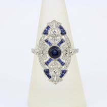 An 850 platinum ring set with a Royal blue sapphire and brilliant cut diamonds, centres sapphire 0.