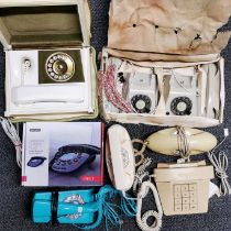 A group of mixed interesting vintage telephones.