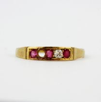An 18ct yellow gold diamond and ruby set ring, (N). One diamond missing and worn hallmark.