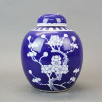 A Chinese prunus patterned porcelain ginger jar and lid, H. 21cm.