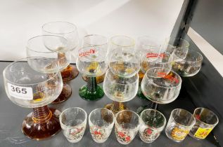 A group of coloured and ribbed stemmed wine glasses and six shot glasses.