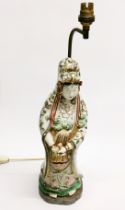 A 19thC Japanese Kutani figure of Kanon (Guanyin) standing on a separate table lamp base, figure