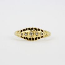 A hallmarked 18ct yellow gold diamond set ring, (L.5).