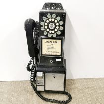 A reproduction wall mounted public telephone, H. 43cm.