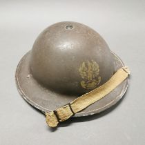 A WW2 British made Polish helmet with the shell and liner both dated 1939.