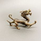 A Chinese bronze figure of a dragon, L. 10cm H. 7cm.