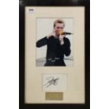 A framed photograph and autograph, signed by Ronan Keating with certificate of authenticity for