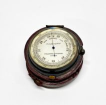 A leather cased pocket barometer, Dia. 5cm.