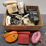 A quantity of vintage telephones.