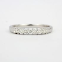 A hallmarked 18ct white gold diamond set half eternity ring, approx. 0.33ct total, (P).