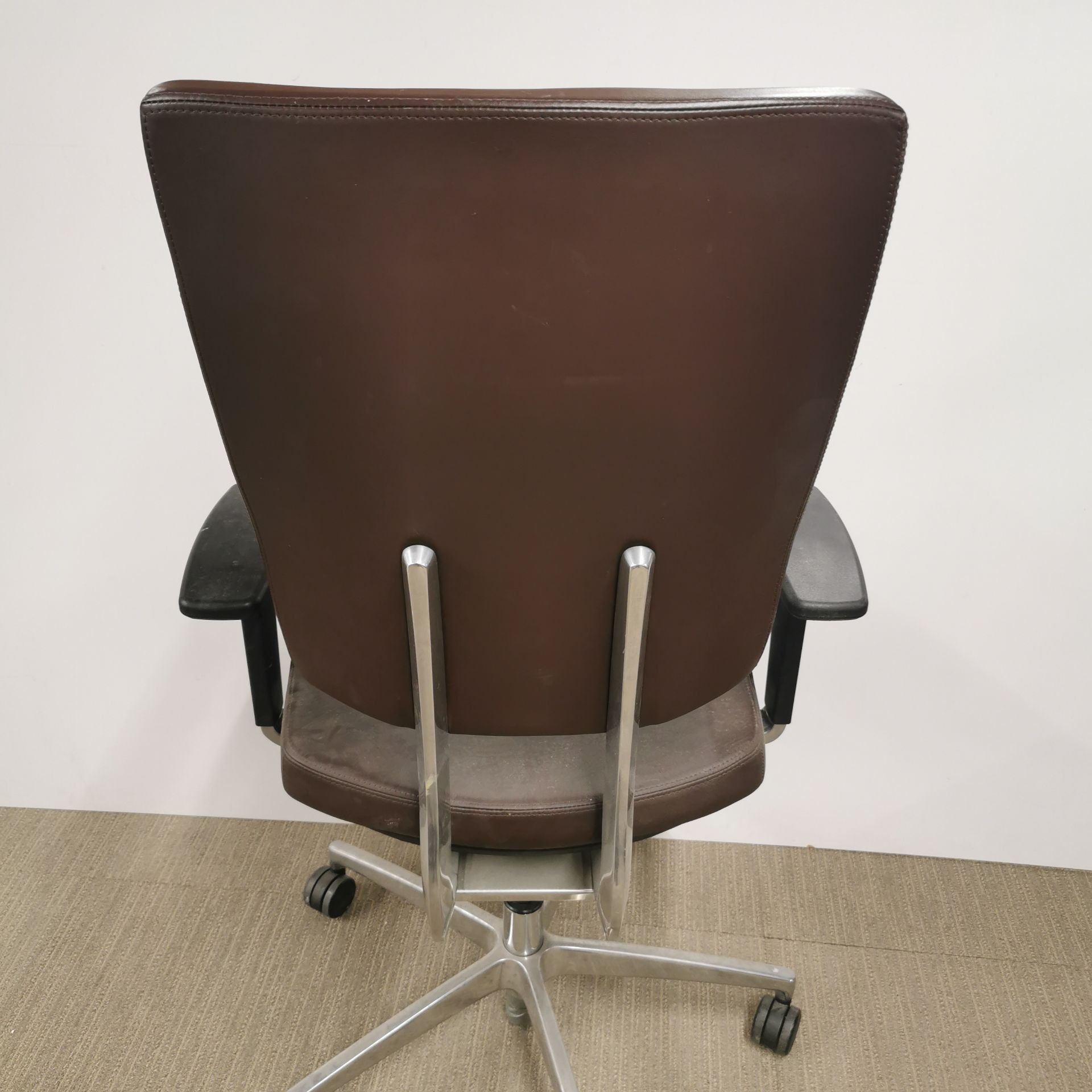 An adjustable faux leather and chrome revolving desk chair. - Image 4 of 4