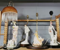 Four resin figural table lamps one with shade , tallest L. 64cm.
