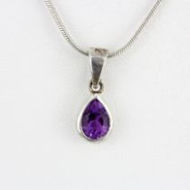 A white metal pendant set with a pear cut amethyst on a 925 silver chain, L. 40cm.