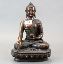 A Tibetan bronze figure of the Buddha, H. 33cm.