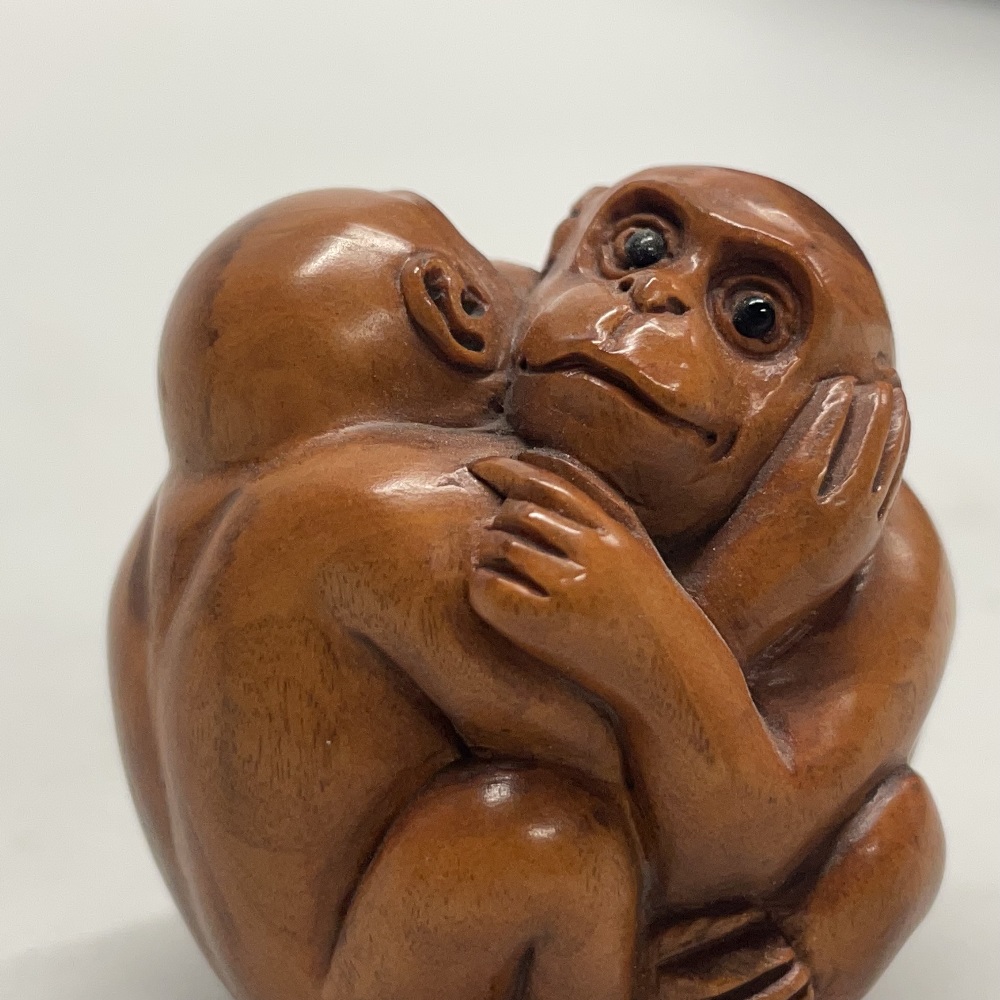 A Chinese carved fruitwood netsuke of a monkey on a branch, together with a further netsuke of two - Image 3 of 3