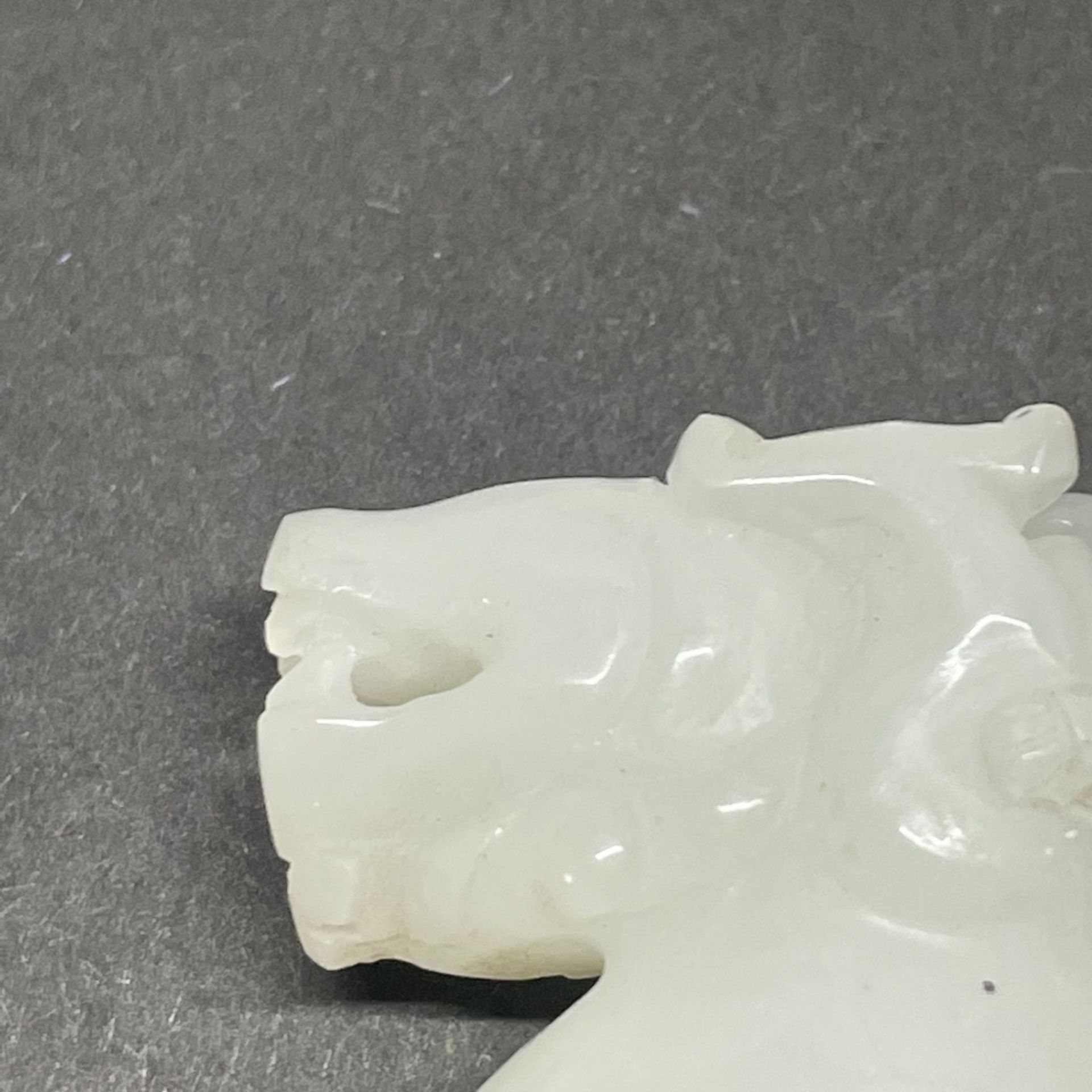 A small Chinese white jade dragon wine cup, H. 5cm. - Image 2 of 3