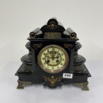 A French slate mantle clock with gilt decoration and porcelain dial, H. 30cm, L. 32cm. Some minor