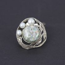 A 925 silver ring inset with a piece of Roman glass and pearls, (N). With certificate.