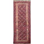 An antique hand woven Eastern rug, 255 x 98cm.