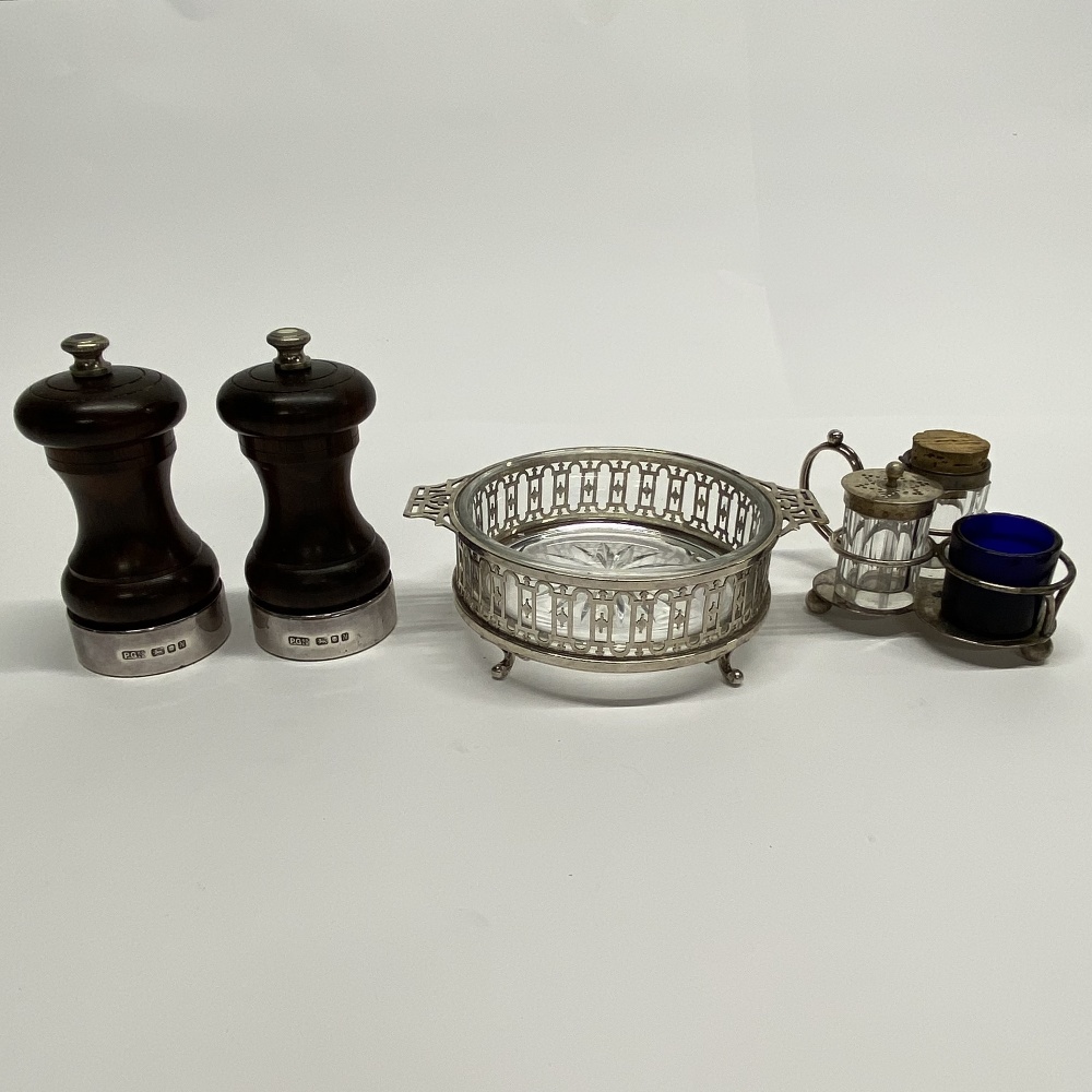 A hallmarked silver and cut glass dish, a pair of hallmarked silver and rosewood pepper and salt