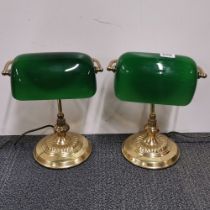 Two glass and brass desk lamps.