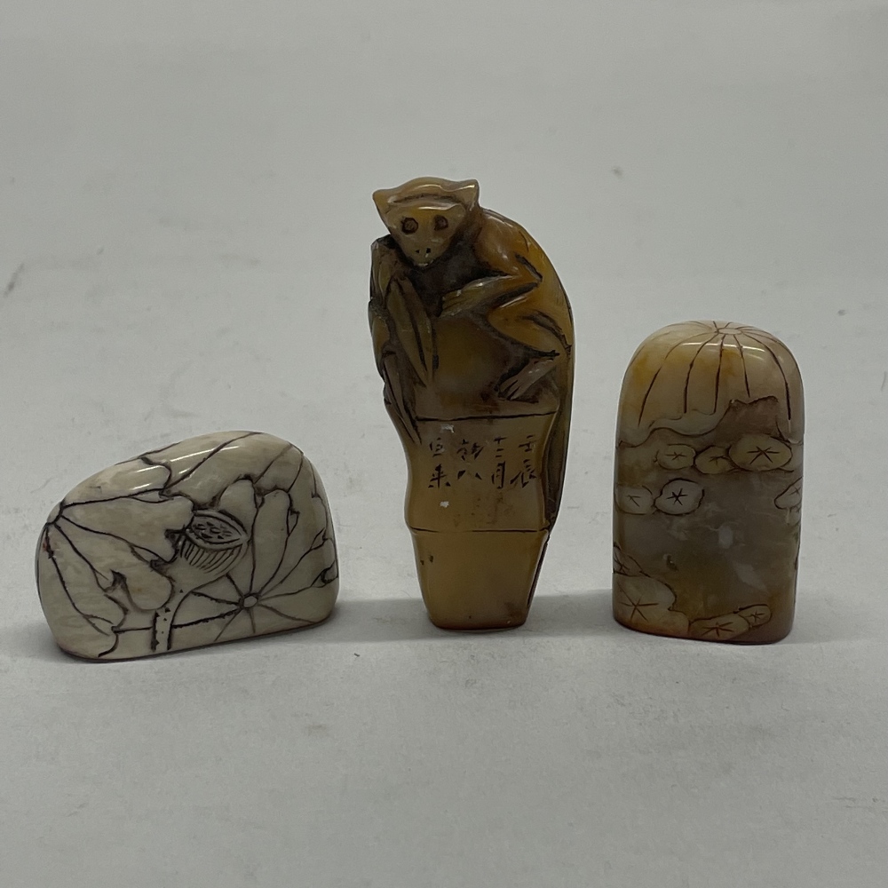 Three small Chinese carved soapstone seals, tallest H. 6cm.