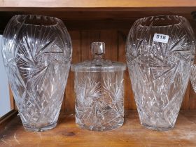 A pair of large cut crystal vases with large matching jar and cover, H. 36cm.