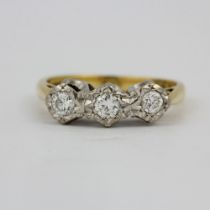 A hallmarked 18ct yellow and white gold diamond set ring, (M).