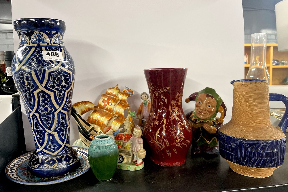 A hand painted pottery vase, H. 31cm with other ceramic items.