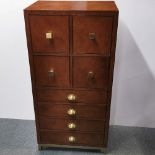 A heavy quality wood and leather eight drawer chest with fabric interior and metal handles and base,