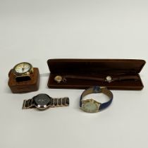 Four vintage watches including Anna Bella and a travelling clock.