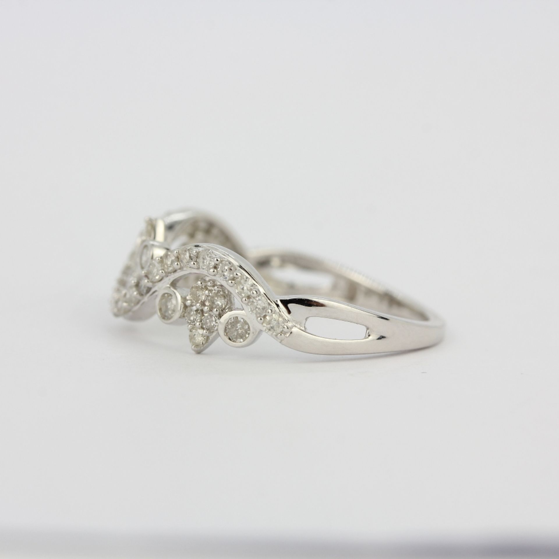 A hallmarked 9ct white gold (marked 10K) diamond set ring, (N.5). - Image 2 of 3