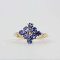 A 14ct yellow gold ring set with cornflower blue sapphires and diamonds, (O.5).