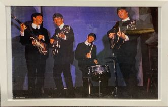 A large framed photographic print of The Beatles, frame size 98 x 68cm.