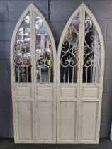 A pair of wood and metal arched door style garden mirrors, 180 x 57cm.