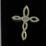 A hallmarked 9ct yellow and white gold diamond set cross pendant, L. 3cm.