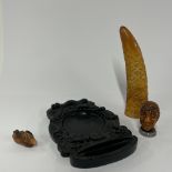 A group of four interesting Chinese composition items, largest H. 24cm.