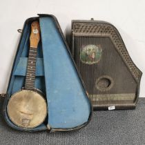 A boxed ukelele and zither.
