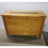 A heavy quality light oak eight drawer sideboard/ chest, 138 x 92 x 52cm.