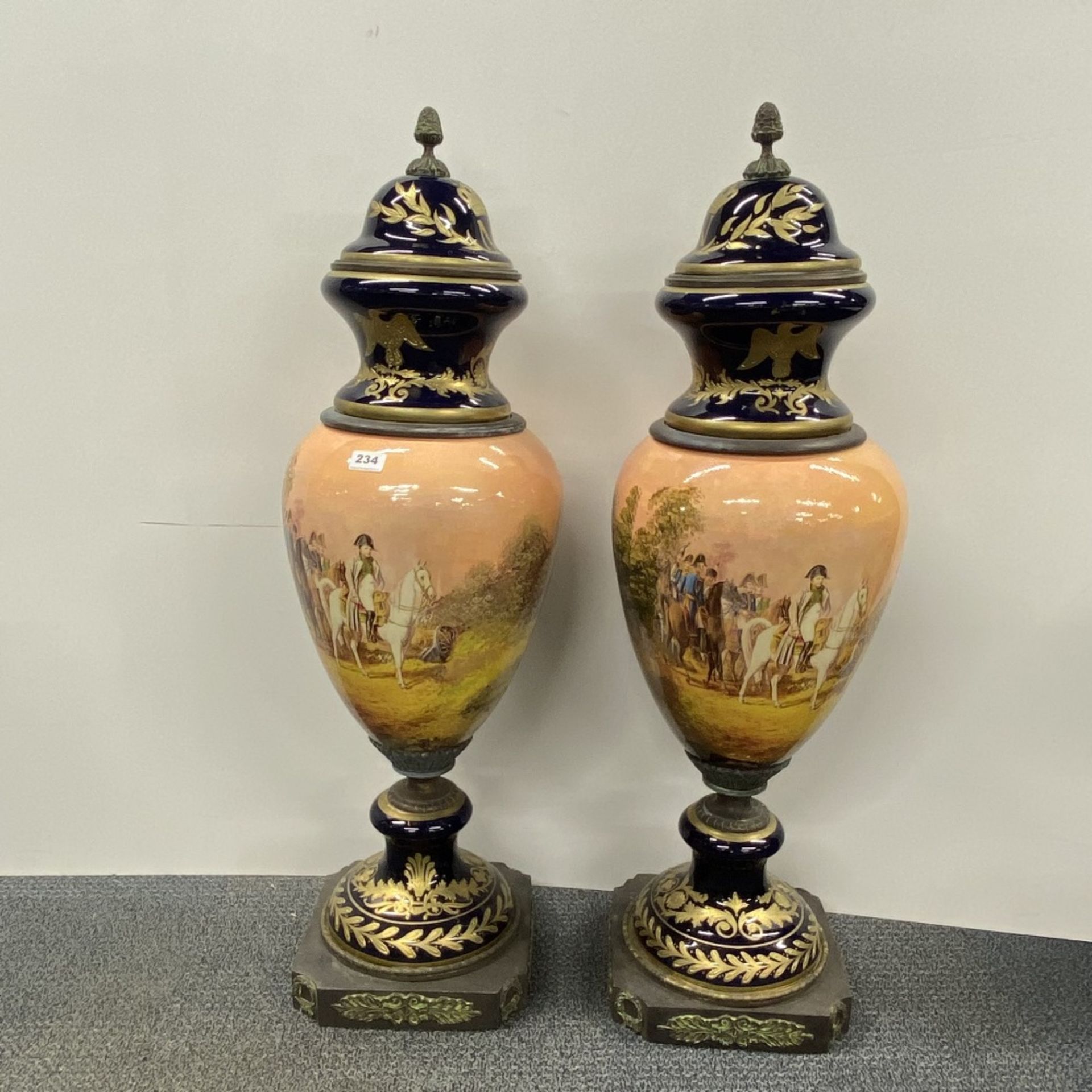 A superb pair of large Continental ceramic and bronze urns and covers, H. 102cm.