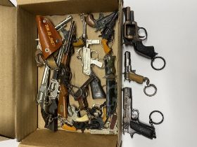 A collection of gun keyrings.