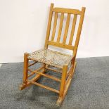 A vintage pine rocking chair, H. 82cm.
