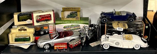 Four large die cast model vehicles and others.