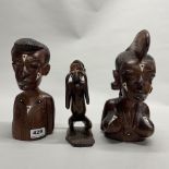 A pair of African carved hardwood busts, H. 24cm. With a carved wooden monkey.