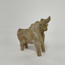 An early part glazed Asian pottery figure of a bull, L. 14cm, H. 13cm.
