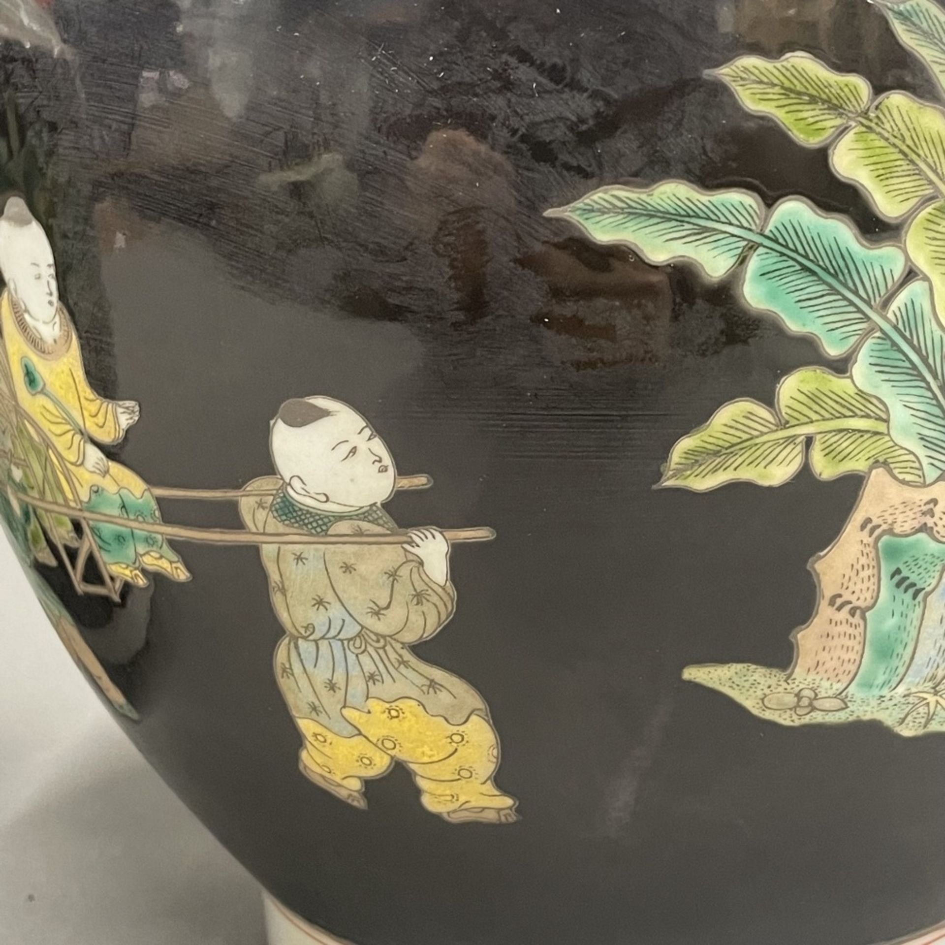 A pair of Chinese famille noire decorated porcelain vases featuring children playing games, H. - Image 2 of 3