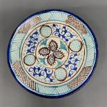 A hand painted pottery plate, Dia. 38cm, a/f.
